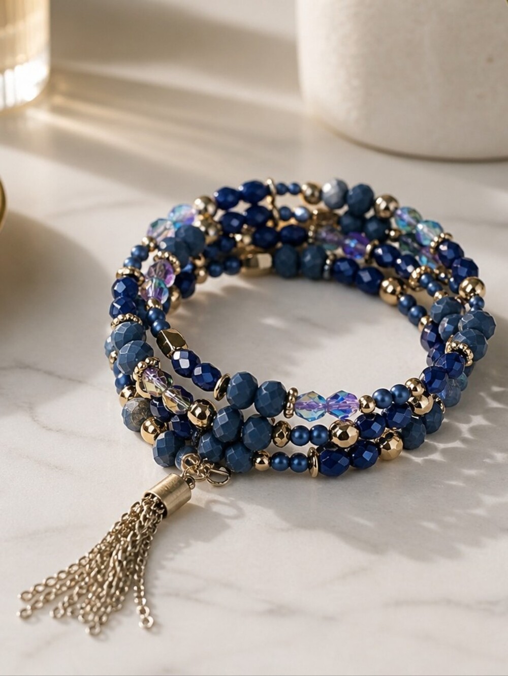 Multi-Strand Blue Bead Bracelet with Gold Tassel